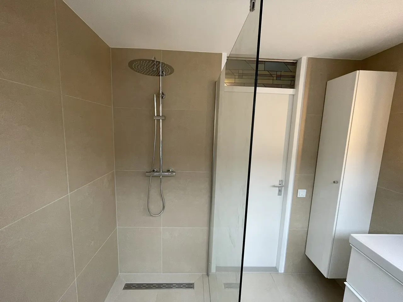 Complete modern bathroom with walk-in shower