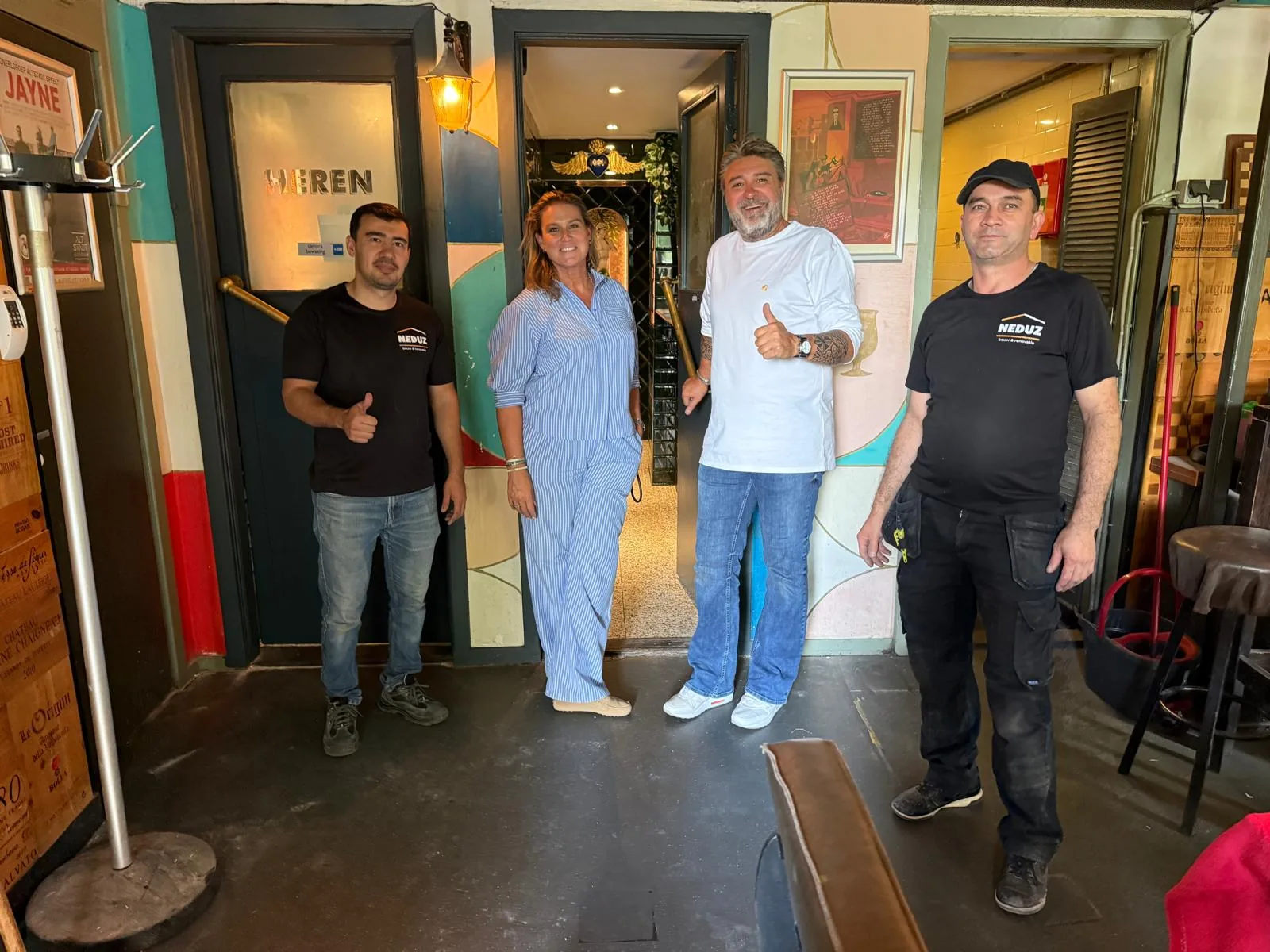 Clients and the Neduz team after a hospitality project handover